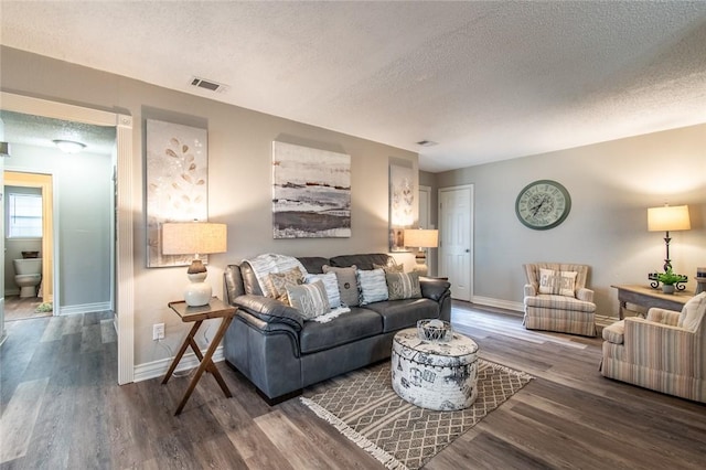 7322 Milky Way Dr, Corpus Christi, TX 78412 - living area featuring a textured ceiling and wood finished floors