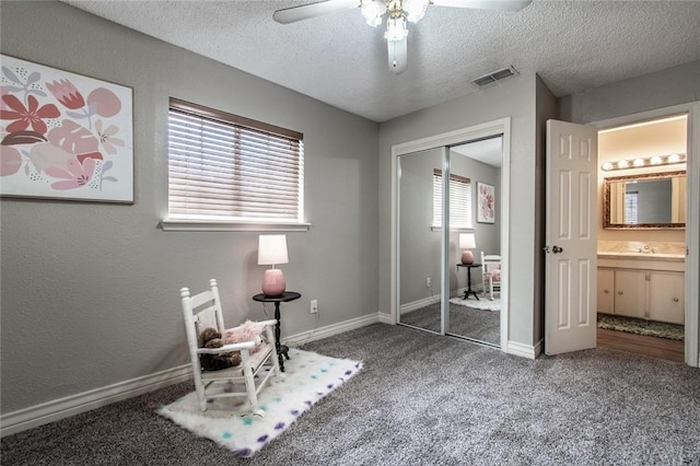 7322 Milky Way Dr, Corpus Christi, TX 78412 - bedroom featuring carpet, a textured ceiling, a closet, and a ceiling fan
