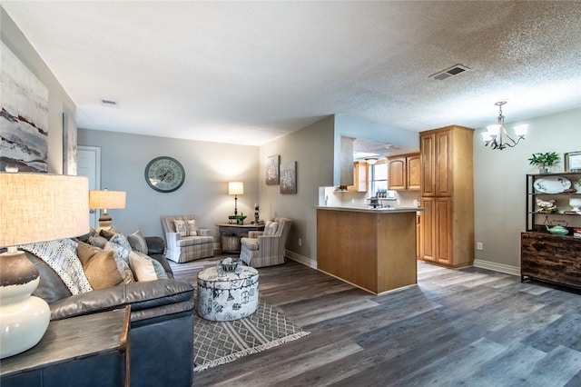 7322 Milky Way Dr, Corpus Christi, TX 78412 - living room featuring a chandelier and dark wood-type flooring