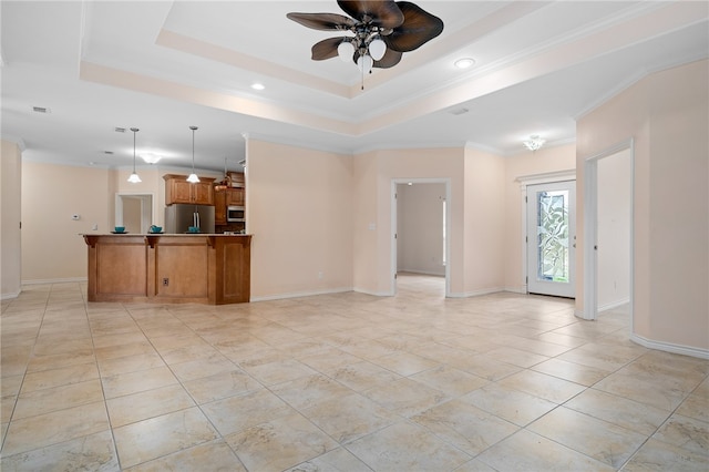 unfurnished living room with ceiling fan, crown molding, and a tray ceiling