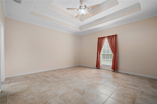 unfurnished room featuring ceiling fan, a raised ceiling, and crown molding