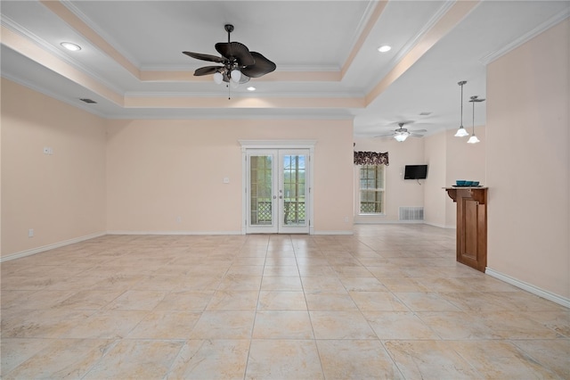 unfurnished living room featuring ceiling fan, french doors, ornamental molding, and a raised ceiling