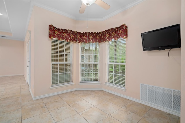 empty room with ceiling fan and crown molding