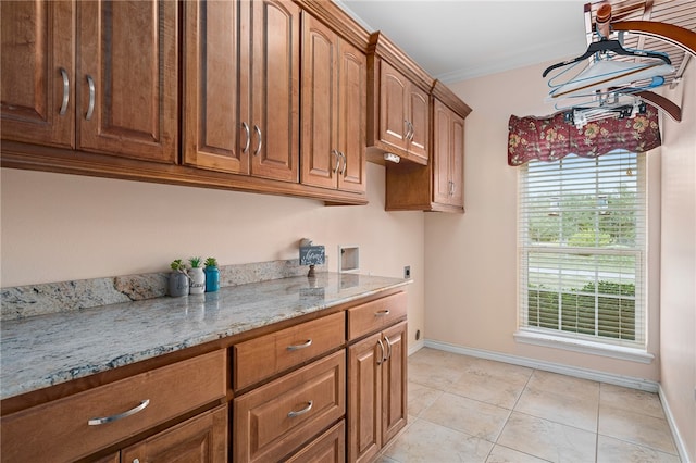 kitchen featuring light stone counters and light tile patterned floors