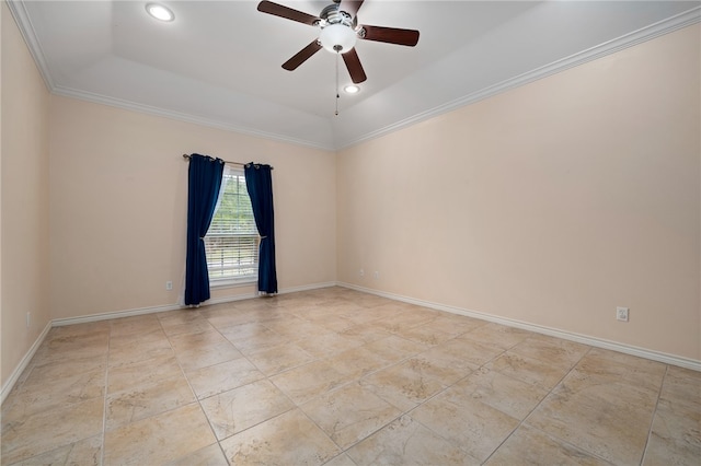 unfurnished room with a tray ceiling, ceiling fan, and crown molding