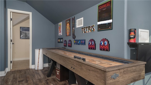 rec room featuring vaulted ceiling and dark hardwood / wood-style floors