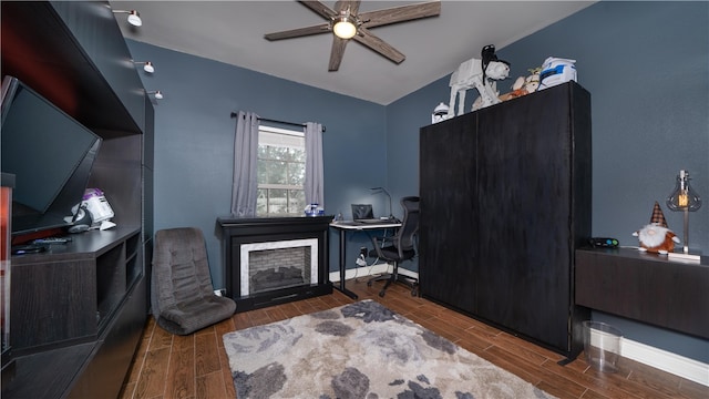 bedroom featuring ceiling fan and dark hardwood / wood-style floors