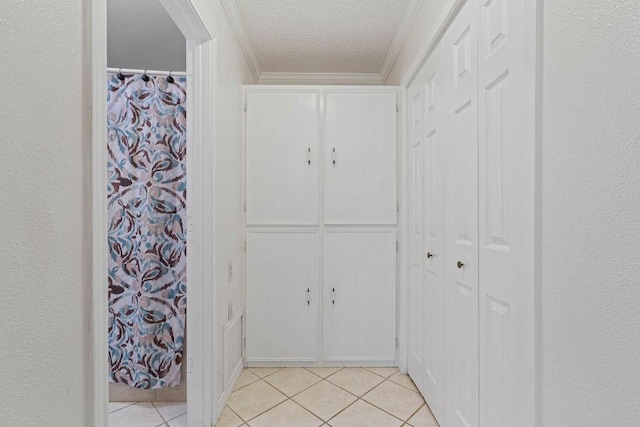 3605 Rushing Blvd, Corpus Christi, TX 78410 - hall featuring light tile patterned floors, a textured ceiling, and ornamental molding