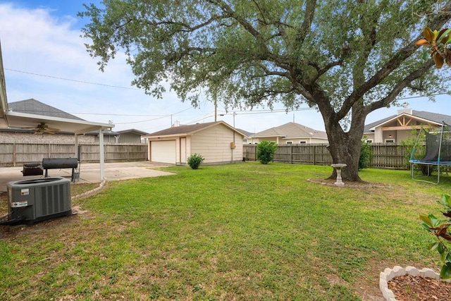 3605 Rushing Blvd, Corpus Christi, TX 78410 - view of yard with a trampoline, central air condition unit, an outbuilding, a patio, and concrete driveway