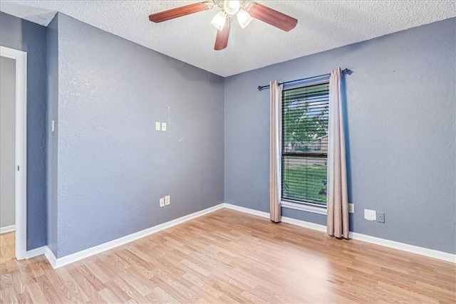 10502 Hemlock Rd, Corpus Christi, TX 78410 - unfurnished room with light wood finished floors, a textured ceiling, a ceiling fan, and a textured wall