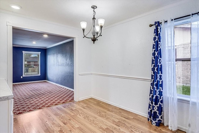 10502 Hemlock Rd, Corpus Christi, TX 78410 - carpeted spare room with ornamental molding, healthy amount of natural light, a chandelier, and wood finished floors