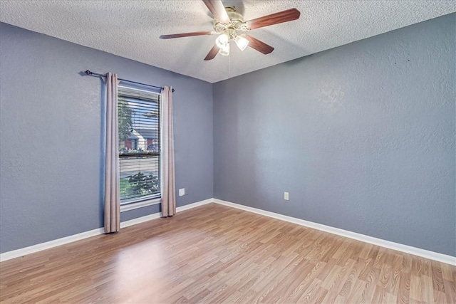 10502 Hemlock Rd, Corpus Christi, TX 78410 - empty room featuring a textured ceiling, wood finished floors, ceiling fan, and a textured wall