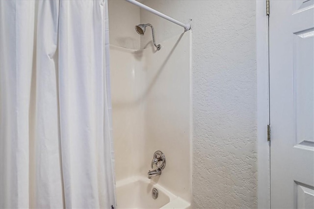 10502 Hemlock Rd, Corpus Christi, TX 78410 - full bathroom with a textured wall and shower / bath combination with curtain