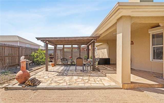 view of patio / terrace featuring fence and a pergola