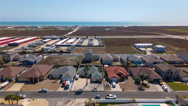 bird's eye view with a residential view and a water view