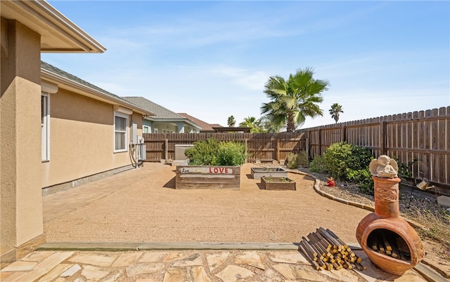 view of yard featuring a patio and a fenced backyard