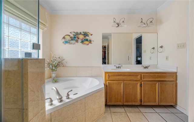 full bathroom featuring a sink, a garden tub, ornamental molding, and tile patterned floors