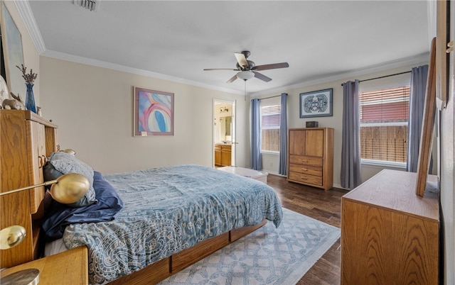 bedroom featuring visible vents, connected bathroom, dark wood-type flooring, ornamental molding, and a ceiling fan