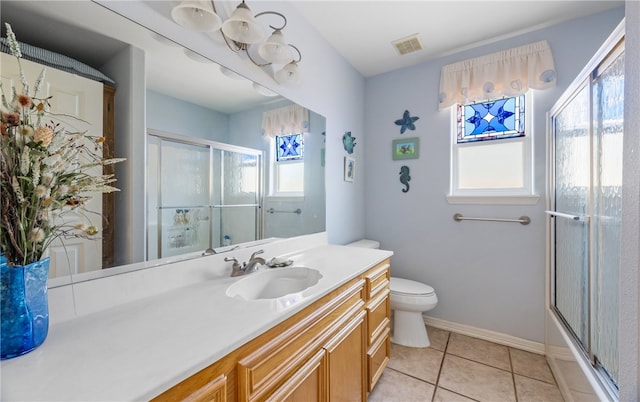 bathroom featuring a shower with shower door, visible vents, tile patterned floors, toilet, and vanity