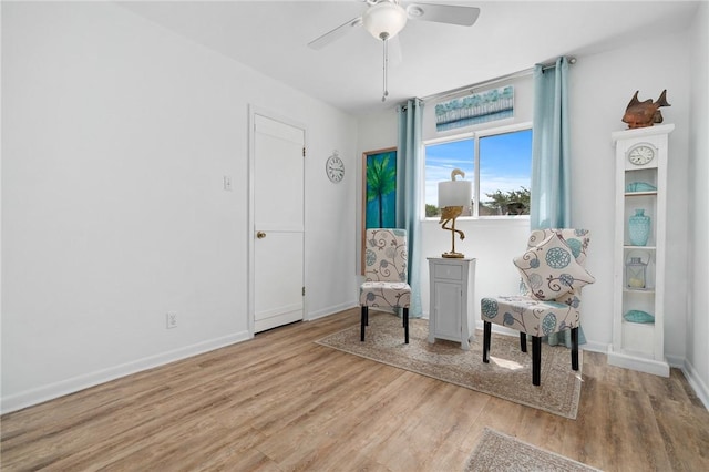 119 Misty Ln, Aransas Pass, TX 78336 - living area featuring light wood-type flooring, ceiling fan, and baseboards