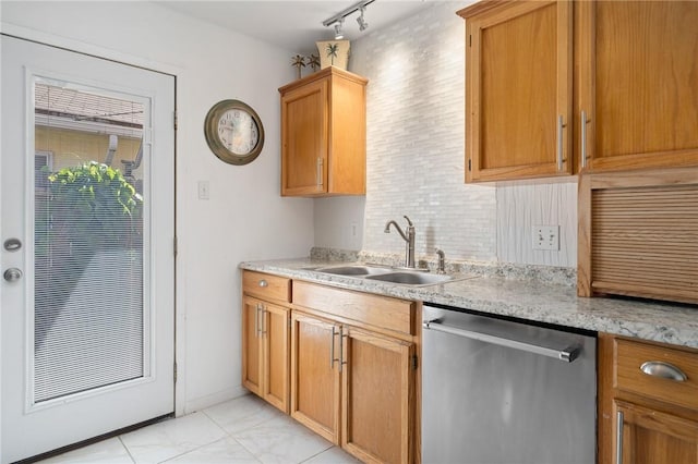 119 Misty Ln, Aransas Pass, TX 78336 - kitchen with stainless steel dishwasher, a sink, decorative backsplash, and track lighting