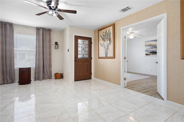 119 Misty Ln, Aransas Pass, TX 78336 - foyer with ceiling fan, baseboards, and light marble finish floors