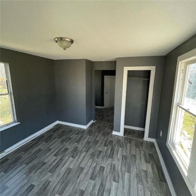 spare room featuring dark hardwood / wood-style floors