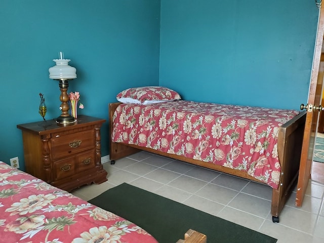 bedroom with light tile patterned floors