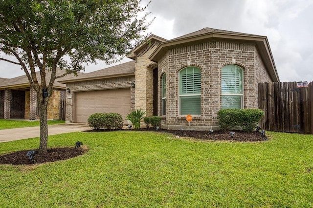 ranch-style house featuring concrete driveway, brick siding, a front yard, and fence