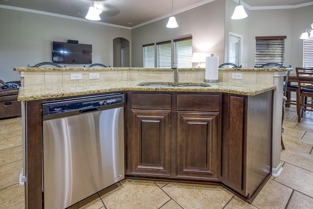 kitchen featuring light stone counters, decorative light fixtures, crown molding, a sink, and dishwasher