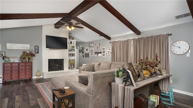 living room featuring lofted ceiling with beams, ceiling fan, a fireplace, and dark hardwood / wood-style flooring