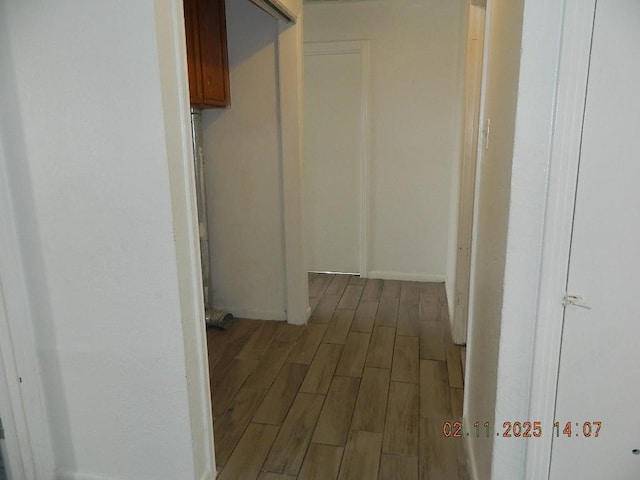 corridor featuring dark hardwood / wood-style flooring