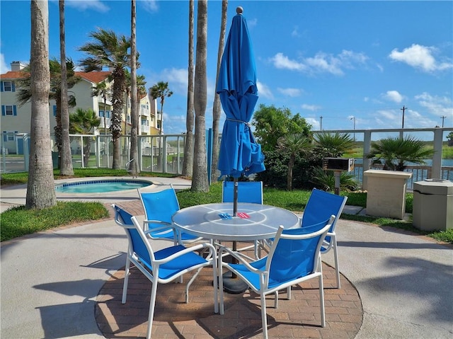 view of patio / terrace with a hot tub