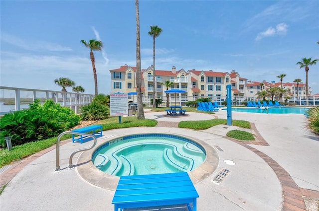 view of pool featuring a community hot tub