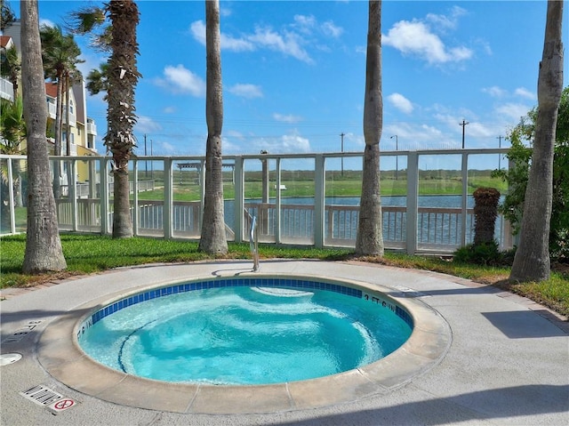 view of pool featuring a water view