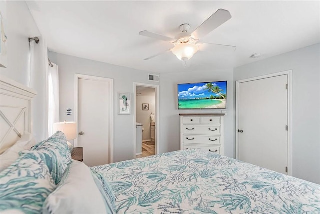 bedroom with ceiling fan and connected bathroom