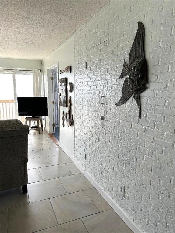 corridor featuring a textured ceiling