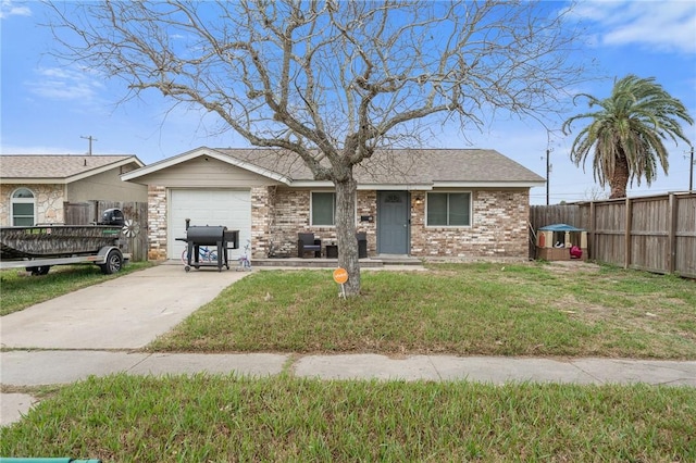 ranch-style house featuring a garage and a front yard