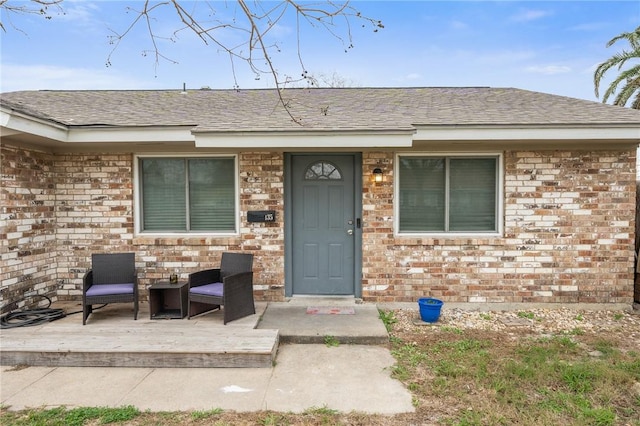 doorway to property with a patio