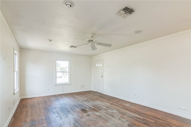 empty room with hardwood / wood-style floors, ceiling fan, and crown molding