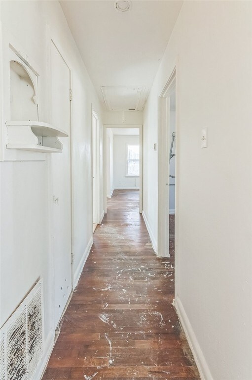 hall with dark hardwood / wood-style floors