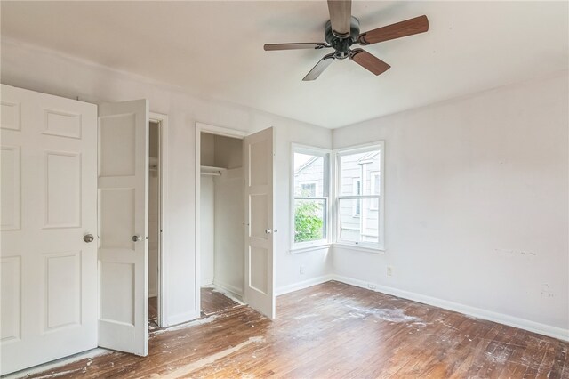 unfurnished bedroom featuring hardwood / wood-style flooring and ceiling fan