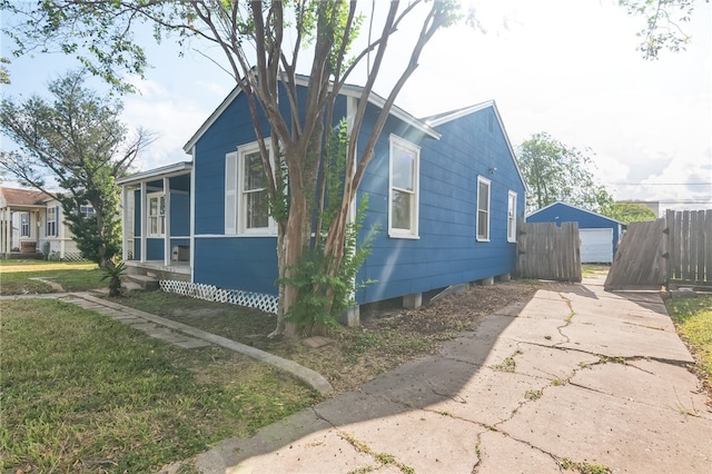 view of side of home featuring a yard