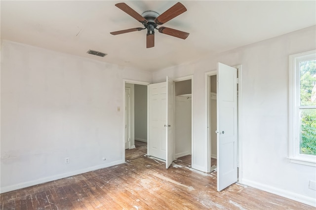 unfurnished bedroom featuring hardwood / wood-style flooring and ceiling fan