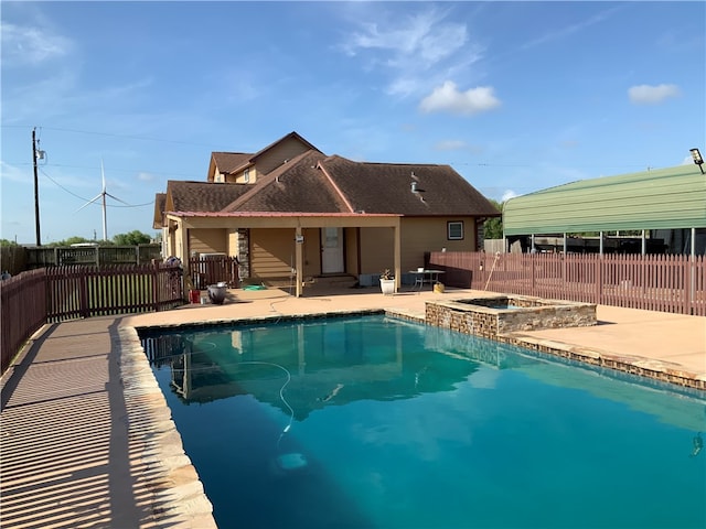 view of swimming pool with an in ground hot tub and a patio area