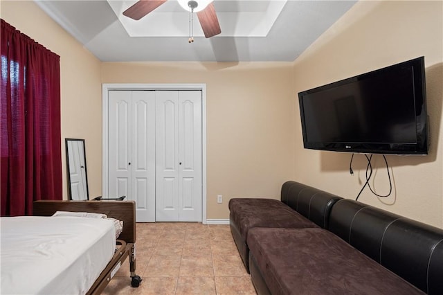 2401 Handlin Dr, Corpus Christi, TX 78418 - bedroom with a ceiling fan, a skylight, light tile patterned floors, and a closet