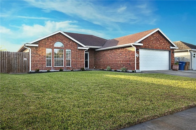 2401 Handlin Dr, Corpus Christi, TX 78418 - single story home with a front lawn, fence, brick siding, an attached garage, and driveway