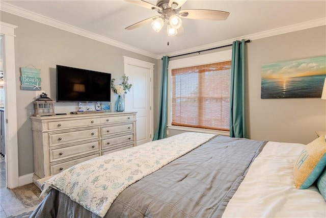 356 E Sagebrush St, Rockport, TX 78382 - bedroom with ornamental molding, wood finished floors, ceiling fan, and baseboards