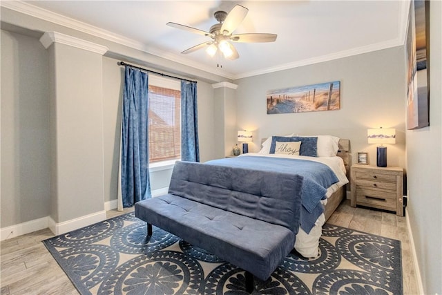 356 E Sagebrush St, Rockport, TX 78382 - bedroom with ornamental molding, baseboards, light wood-style floors, and a ceiling fan