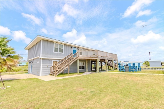356 E Sagebrush St, Rockport, TX 78382 - back of house with stairway, a yard, a deck, and concrete driveway